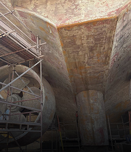 Metal structure with scaffolding in a scrap yard